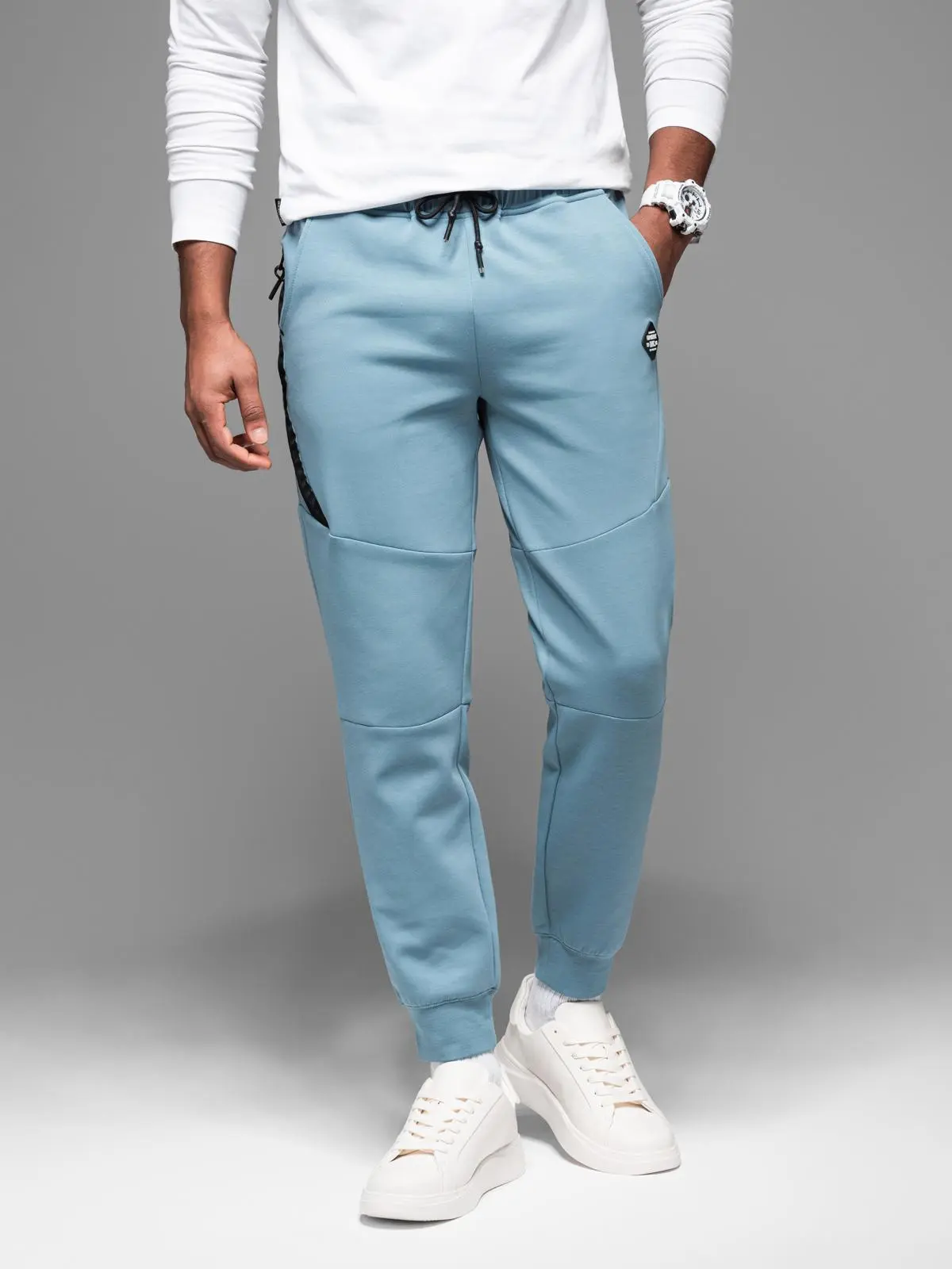 Ombre Men's sweatpants with ribbed cuffs and decorative zipper - light blue