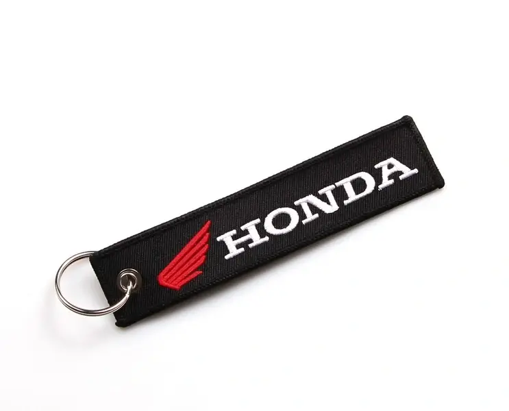 TXR Textilní klíčenka Honda (Elegantní přívěsek - černý podklad s kontrastním červeným logem a bílým nápisem Honda.)