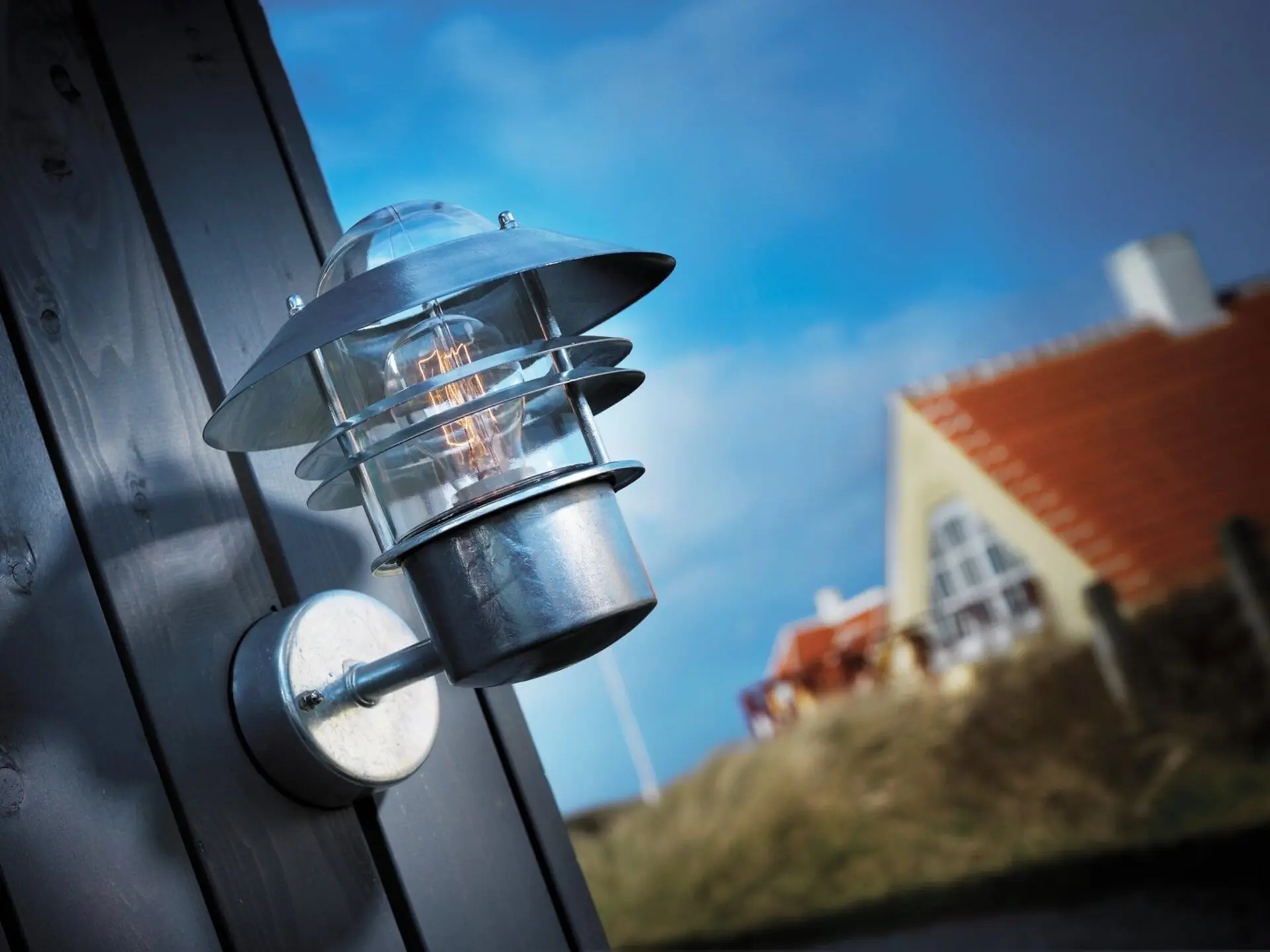 NOR 25011031 Venkovní nástěnné svítidlo Blokhus 1x60W E27 galvanizovaná čirá - NORDLUX