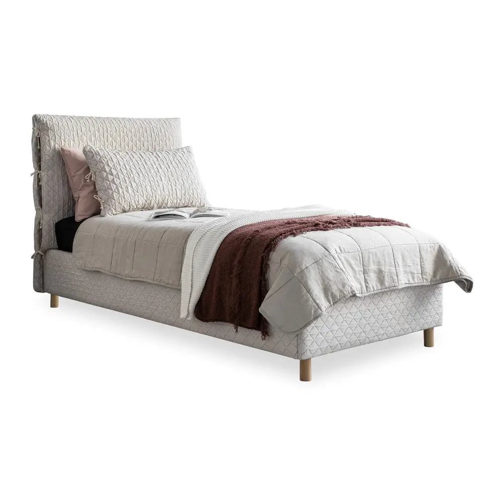 Béžová čalouněná jednolůžková postel s