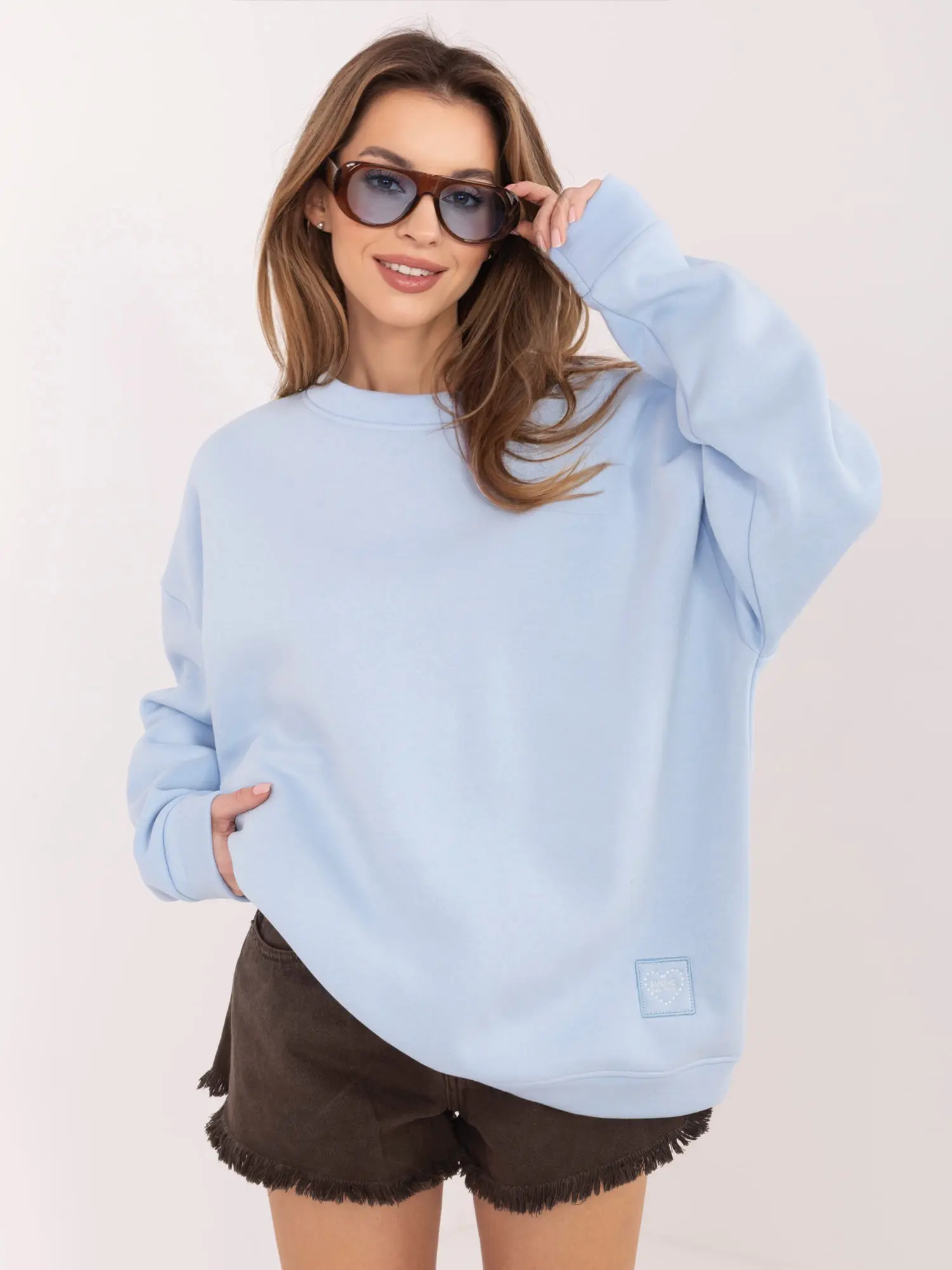 Pastelově modrá oversize mikina bez kapuce