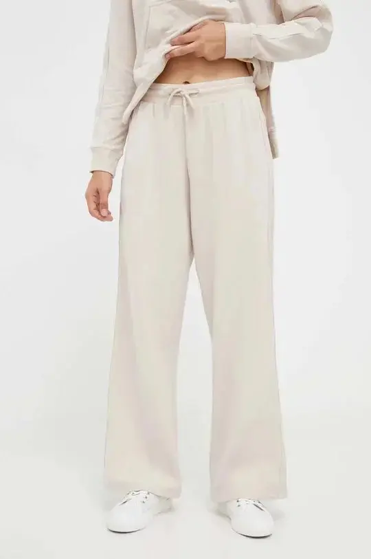 Dámské kalhoty UW0UW04771 ABH sv. béžové - Tommy Hilfiger L