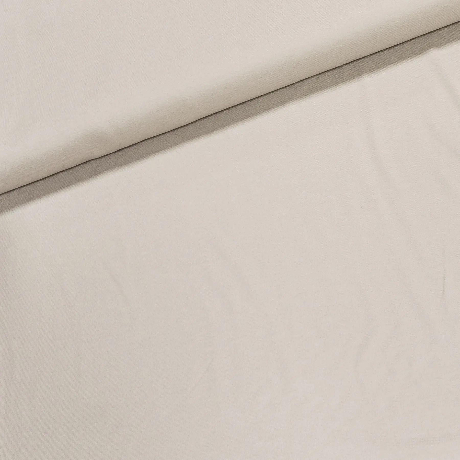 Viskózový úplet UNI PR0001-052, jednobarevný světle béžový, š.145cm (látka v metráži)