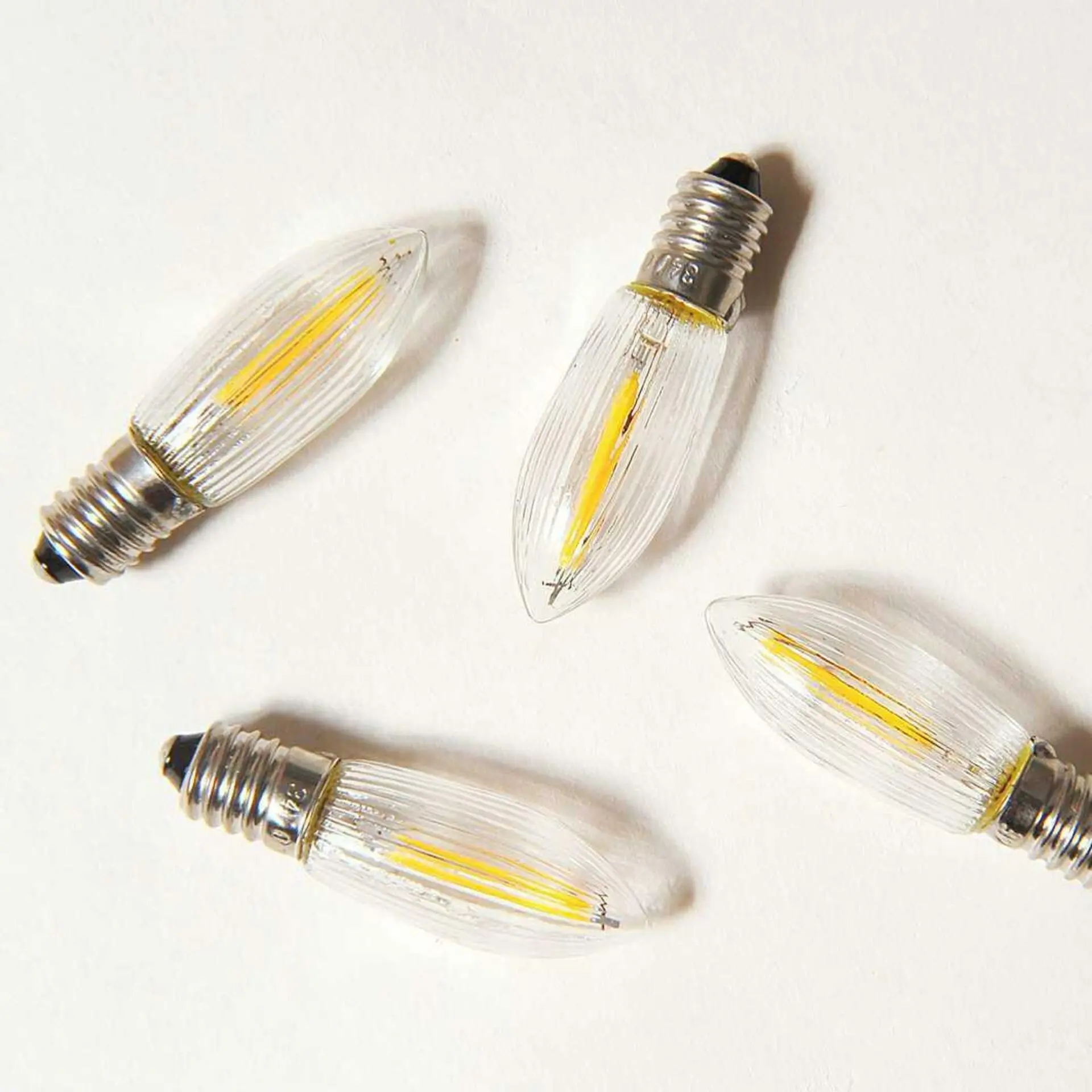 Exihand Čirá žárovka LED FILAMENT pro svícen 14-55V/0,3W, balení 64 ks